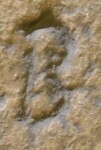 A close-up of an instance of allograph Β type1.1 inscribed on object ISic002754