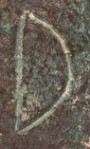 A close-up of an instance of allograph Δ type1.1 inscribed on object ISic030002
