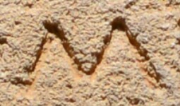 A close-up of an instance of allograph Μ type1.1 inscribed on object ISic001087