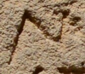 A close-up of an instance of allograph Ν type1.1 inscribed on object ISic001087