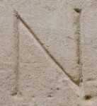 A close-up of an instance of allograph Ν type2.2 inscribed on object ISic003365