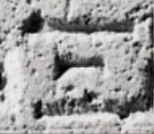 A close-up of an instance of allograph Ξ type1 inscribed on object ISic002948