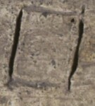 A close-up of an instance of allograph Ο type5 inscribed on object ISic020603