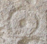 A close-up of an instance of allograph Ο type6 inscribed on object ISic001476
