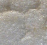 A close-up of an instance of allograph Τ type2.4 inscribed on object ISic000833