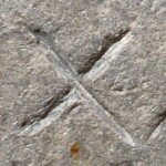 A close-up of an instance of allograph Χ type3 inscribed on object ISic001151