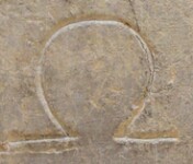 A close-up of an instance of allograph   inscribed on an object