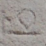 A close-up of an instance of allograph   inscribed on an object