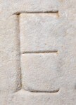 A close-up of an instance of allograph   inscribed on an object