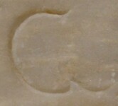 A close-up of an instance of allograph   inscribed on an object