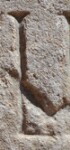 A close-up of an instance of allograph   inscribed on an object