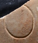 A close-up of an instance of allograph   inscribed on an object