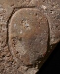 A close-up of an instance of allograph   inscribed on an object