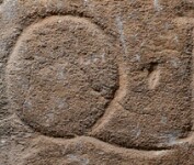 A close-up of an instance of allograph   inscribed on an object