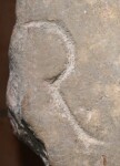 A close-up of an instance of allograph   inscribed on an object