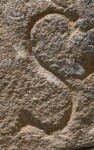 A close-up of an instance of allograph   inscribed on an object