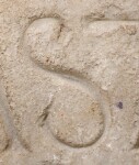 A close-up of an instance of allograph   inscribed on an object