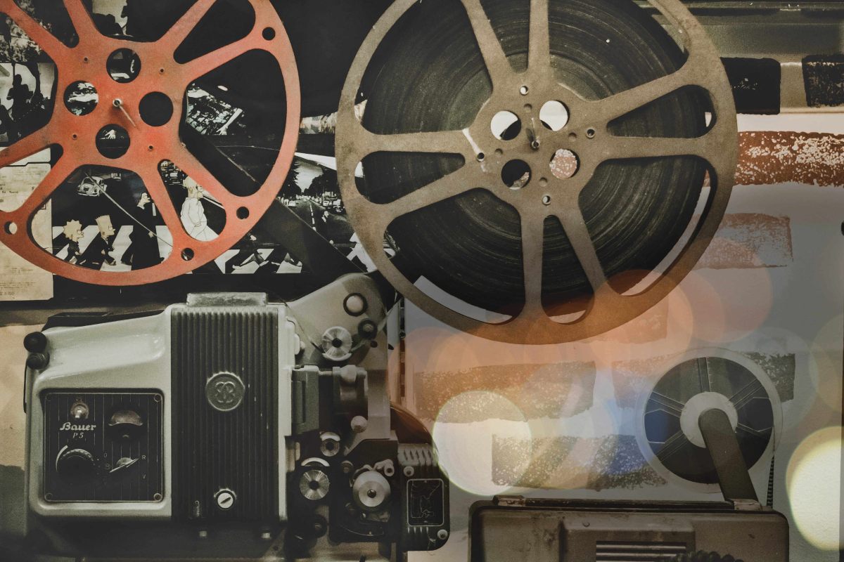 A vintage movie reel and film reel are showcased, evoking nostalgia for the golden age of cinema.