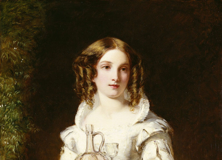 A three-quarter-length portrait of a young woman standing in a doorway, holding a tray. She wears Elizabeth costume: a pale dress with a starched collar, voluminous sleeves, a pointed bodice and full skirt; her blonde hair, however, is in distinctly Victorian ringlets on either side of her face. The silver tray bears a small wine glass and a decanter of red wine; to the left is a vine evidently framing the doorway.